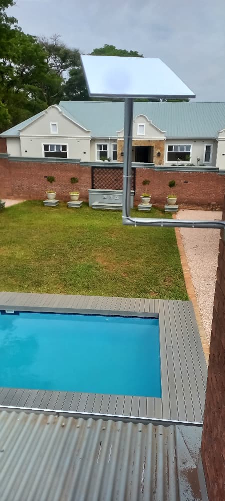 Starlink dish at a luxury residential property with pool