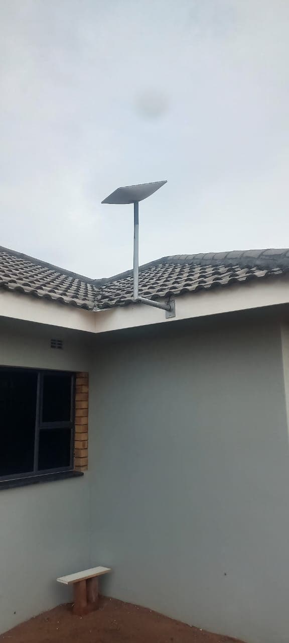 Starlink dish roof bracket on residential home