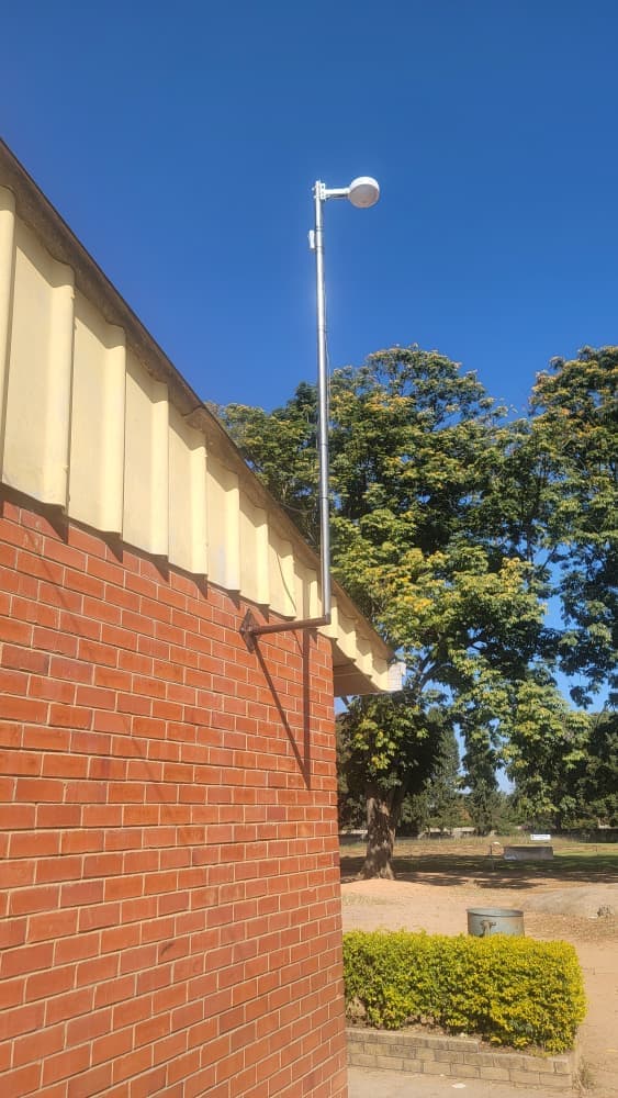 Starlink antenna pole at a school building