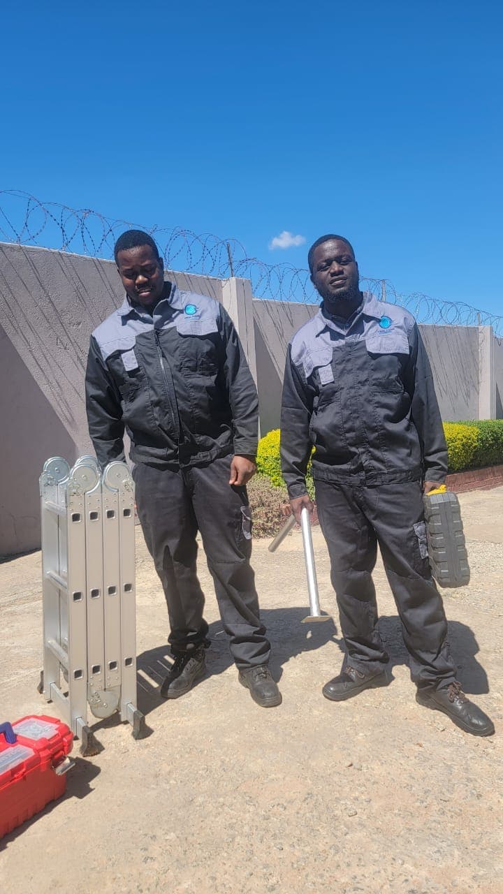 Ideal Focus installation team in uniform with tools